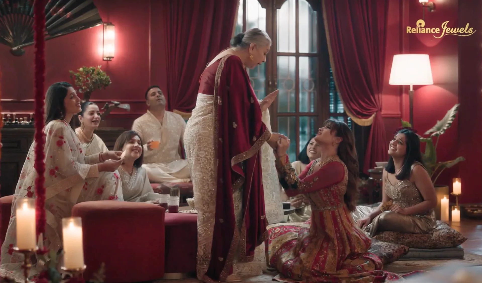 A family celebrating Diwali together, wearing Reliance Jewels