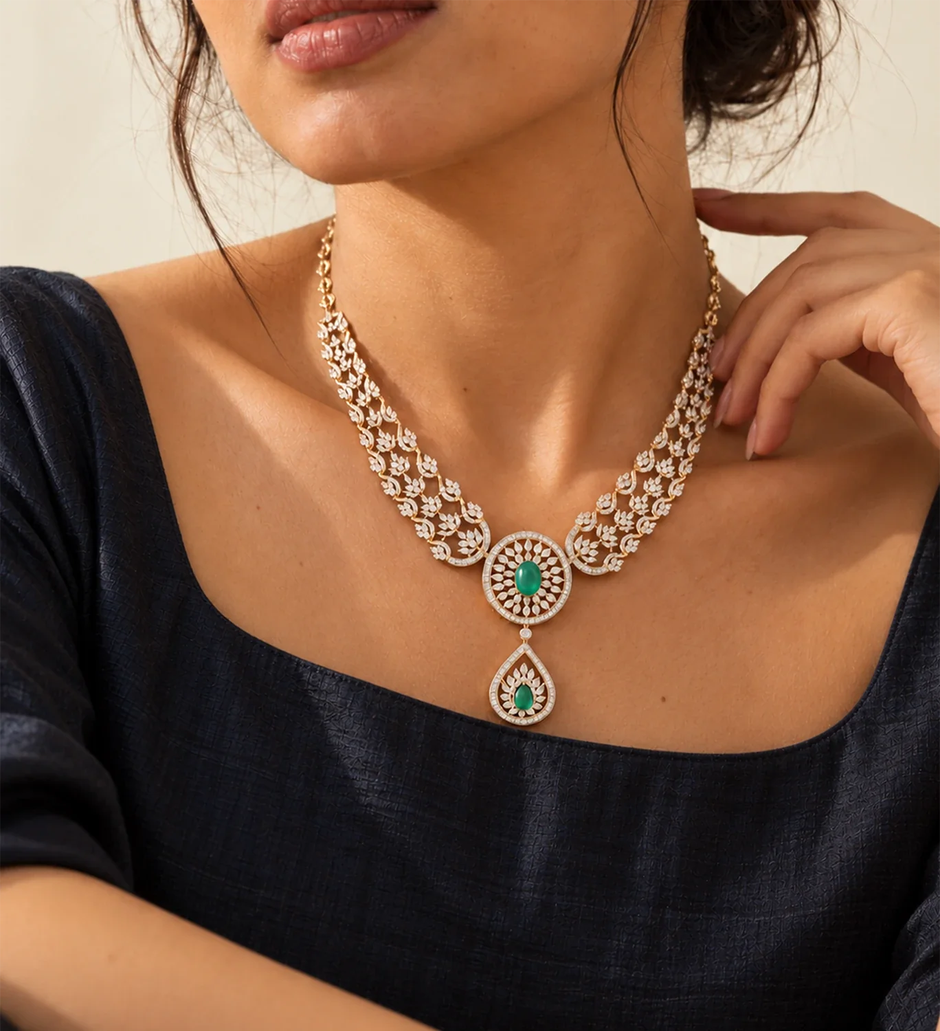 Diamond necklace with a green gemstone pendant